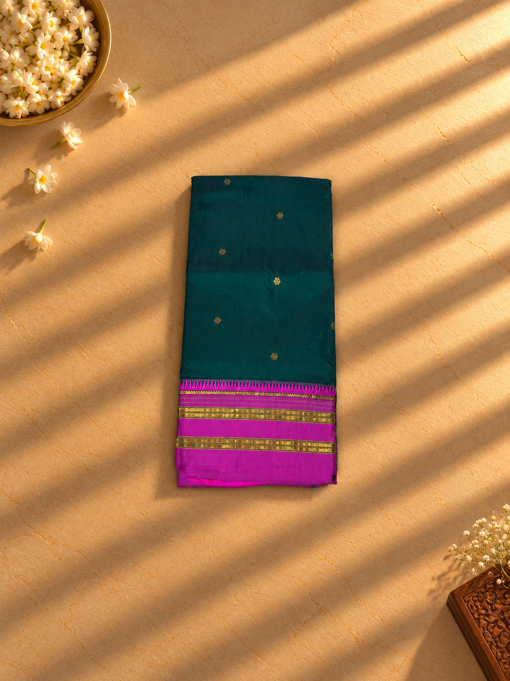 Bottle green Narayanpet cotton saree with magenta temple border, folded