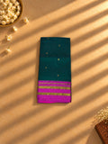 Bottle green Narayanpet cotton saree with magenta temple border, folded