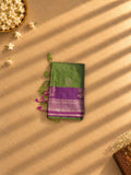 Olive green soft silk saree with purple and silver zari border, folded
