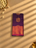 Purple semi silk saree with rani pink and gold zari border, folded